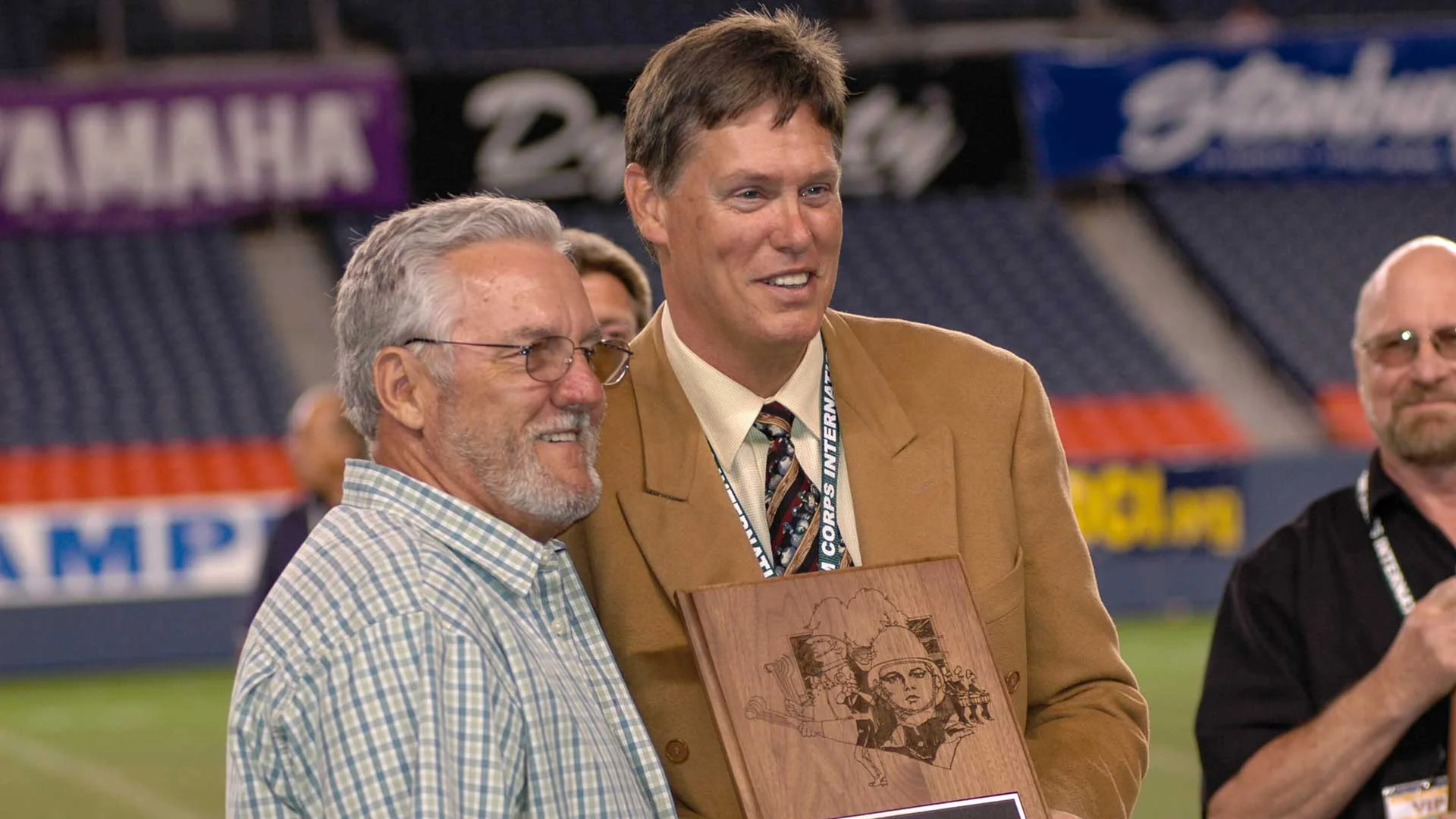 Tom Float (R) was inducted into the DCI Hall of Fame during the 2004 DCI World Championships in Denver.